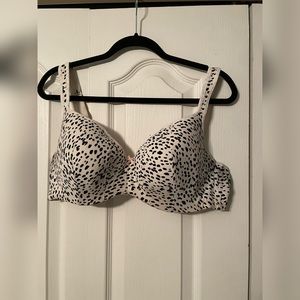 Cacique Bra cream with black spots.
